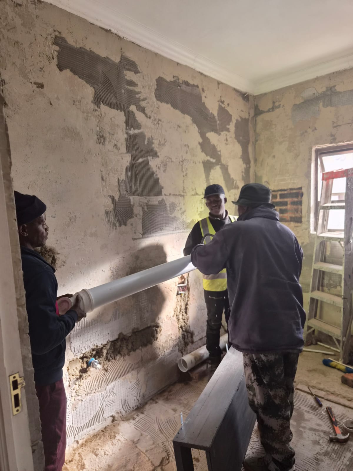 Artisans Installing Drainage